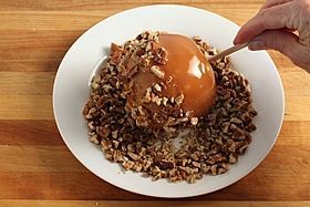 rolling apple in nuts