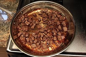 browned meat in pan
