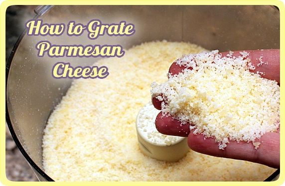 Parmesan Cheese and Grater Above. an above view of a block wedge of  parmesan cheese with shredded pieces all around and a metal cheese grater  on a cutting board Stock Photo