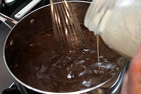 adding flour to pan